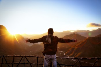 Man in Black Jacket Standing Near Sunset