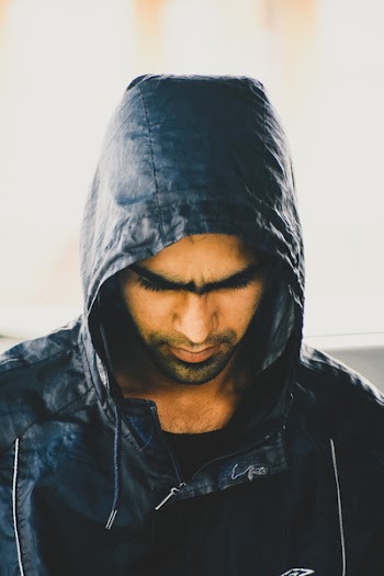 Man in Black Jacket While Looking Down