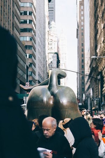 man in black near statue