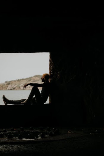Man in Black Shirt Sitting on Boat · Free Stock Photo
