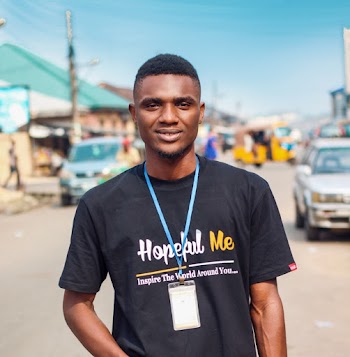 Man in Black Shirt Standing in the Middle of the Road