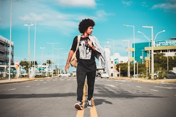 Man in Black Shirt Standing on Roadway
