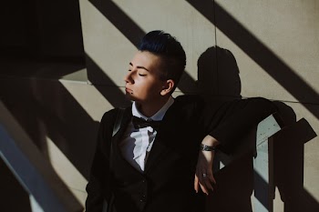 Man in Black Suit Jacket on Stairs