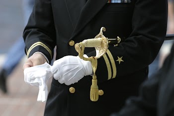 Man In Black Suit Wearing Gloves