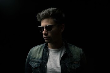 man in black sunglasses and black leather top