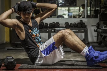 Man In Black Tank Top Inside Gym