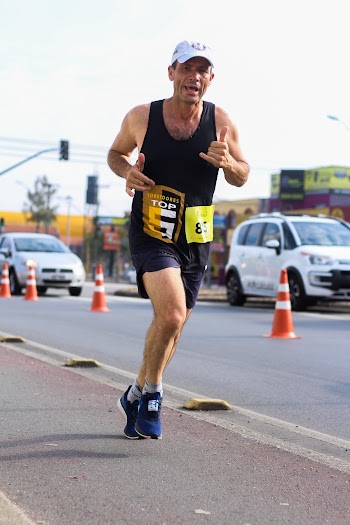 Man in Black Tank Top on Roadside