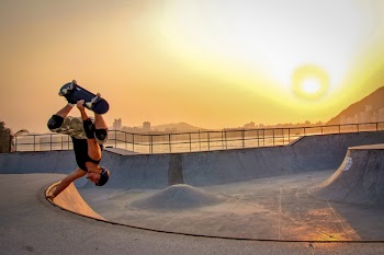 Man In Black Tank Top Skateboarding Wearing Helmet
