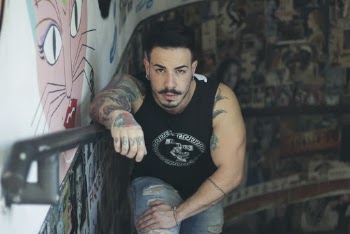 Man In Black Tank Top Standing On Stairs
