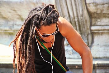 Man in Black Tank Top With Braided Hair