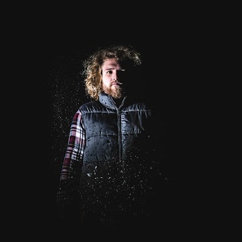 Man in Blond Hair Wearing Black Puffer Vest Standing
