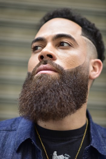 Man in Blue Collared Shirt