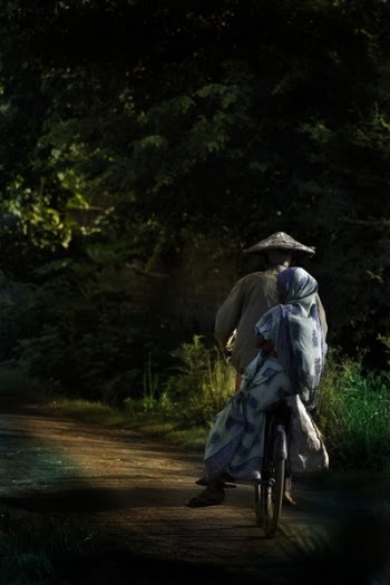 Man in Blue Robe and Brown Hat