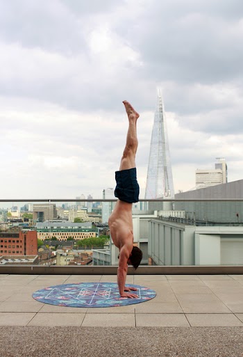 Man in Blue Shorts Tumble Upside Down