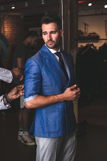 Man in Blue Suit Jacket and Grey Pants