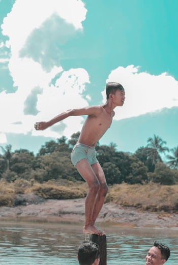 Man in Blue Underwear About to Jump