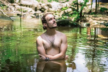 Man In Body Of Water Looking Up