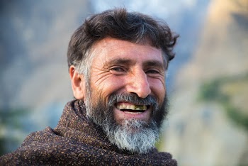 Man in Brown Sweater Smiling