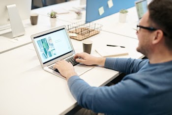 Man in front of his Laptop