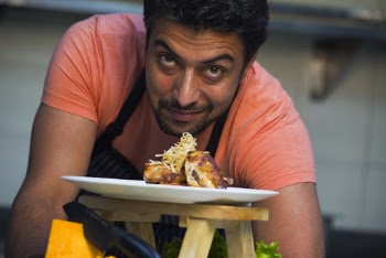 Man in Front of White Plate With Food