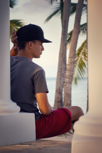 Man in Gray Crew-neck T-shirt and Black Snapback Cap