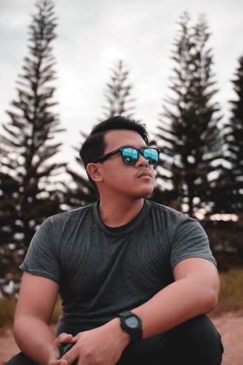 Man in Gray Crew-neck T-shirt Beside Pine Trees