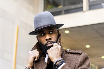 Man in Gray Hat and Brown Coat