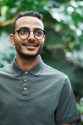 Man in Gray Henley Shirt Wearing Black Framed Eyeglasses