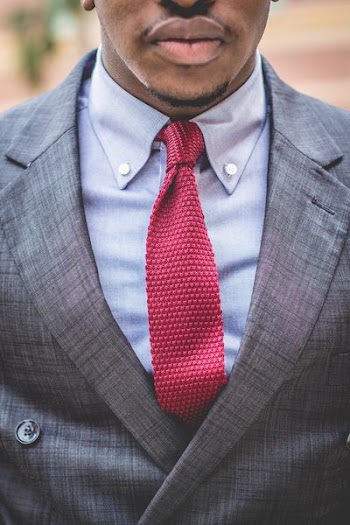 man in gray notch lapel suit jacket