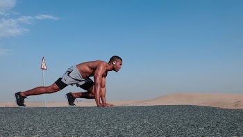 Man in Gray Shorts in Running Position