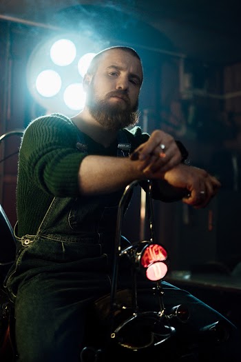 Man in Green Long Sleeved Shirt And Denim Over-All