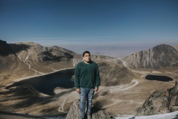 Man In Green Sweater Standing 