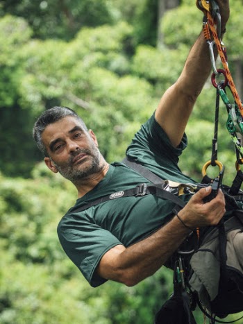 Man In Green T-shirt With Safety Harness