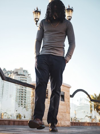 Man in Grey Long-sleeved Shirt and Black Jeans