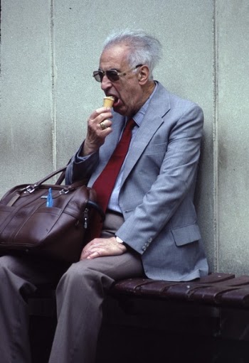 Man In Grey Suit Eating Ice Cream