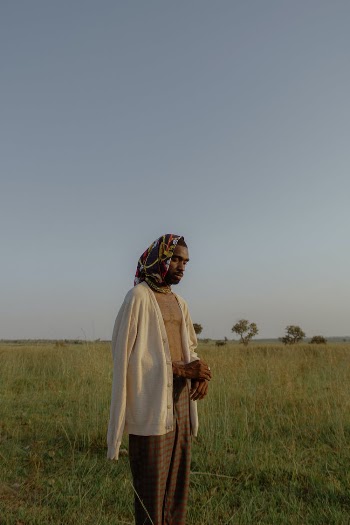 Man in Handkerchief Standing in Field