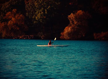 Man in Kayak on Body of Water