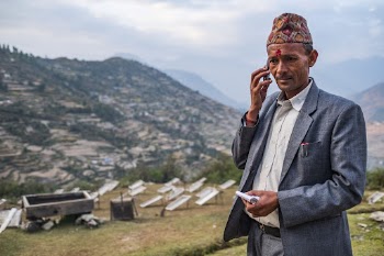 Man in kufi cap on phone, | Free Photo - rawpixel