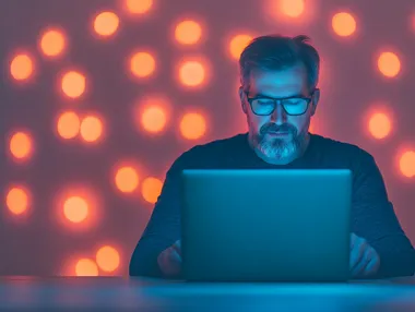 Man in modern office using laptop with AI virtual screen technology Man in modern office using laptop with AI virtual screen technology