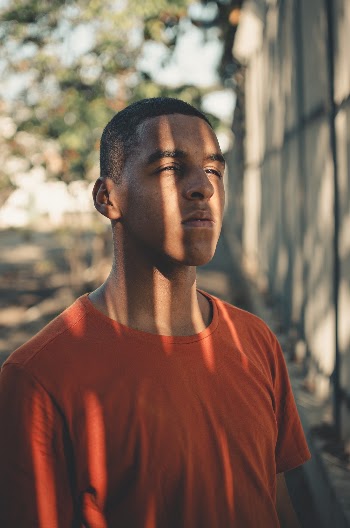 Man in Orange Crew Neck Shirt