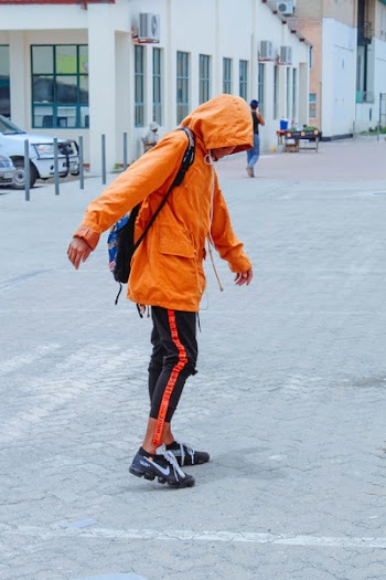 Man In Orange Hoodie 