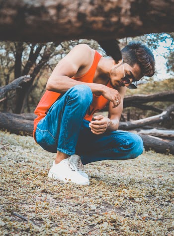 Man in Orange Tank Top