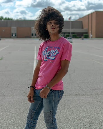 Man in Pink T-shirt and Jeans 