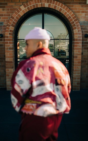 Man in Pink, White, and Red Jacket