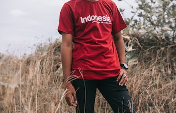 Man in Red Crew-neck T-shirt Beside Grasses