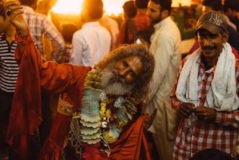 Man in Red Top Smiling on Focus Photography