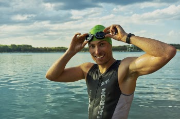 Man in Sleeveless Wet Suit and Swimming Goggles