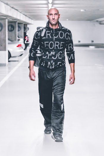 Man in Sweater and Pants Walking