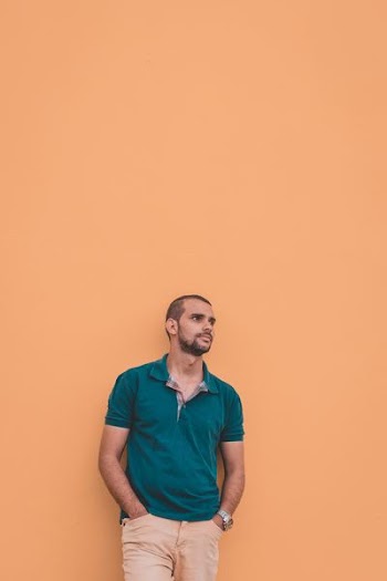 man in teal polo shirt