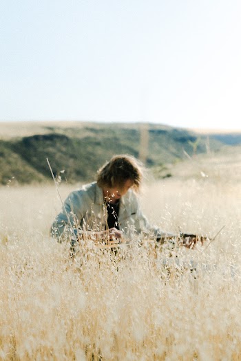 Man In The Middle Of A Field